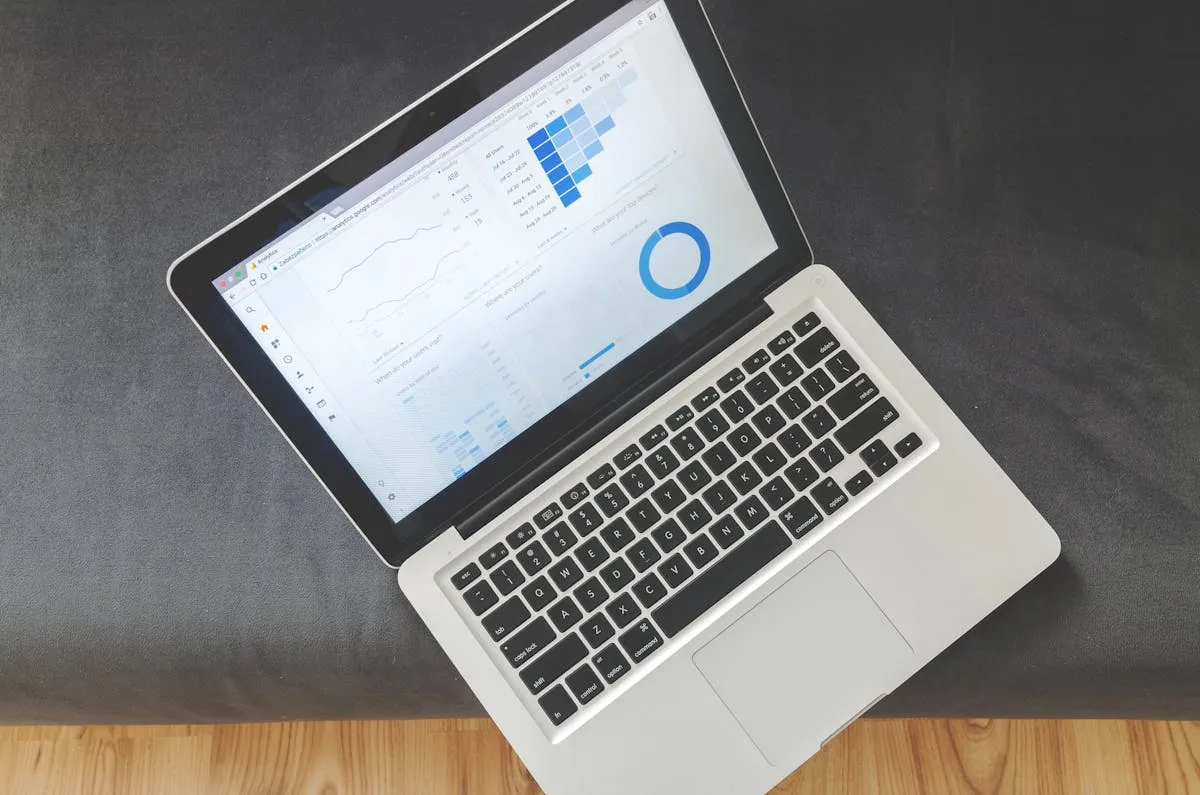 Laptop screen showing SEO analytics data and charts — tracking backlink performance and domain rating growth